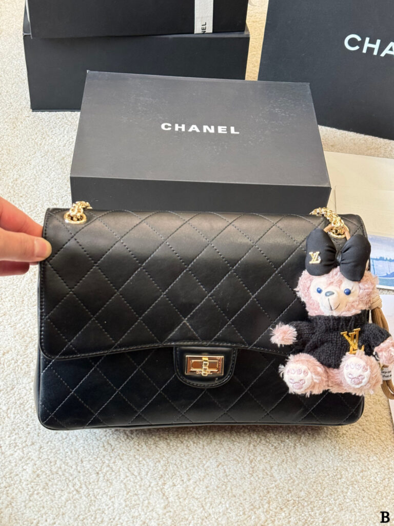 Chanel Reissue 55 Gold Leather Shoulder Bag editorial product context 3