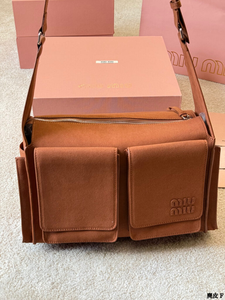 Miu Miu p205 2026 OK 35 Clutch 1.9 x 1.1 editorial product context 2