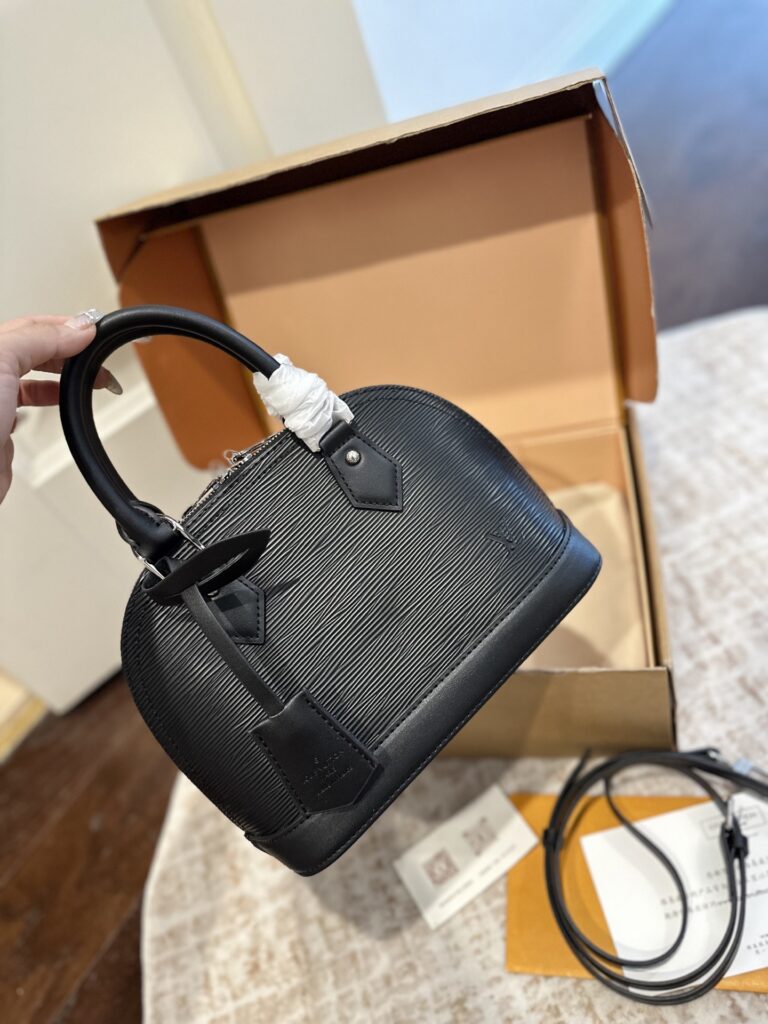 Louis Vuitton Alma Leather Handbag editorial product context 2
