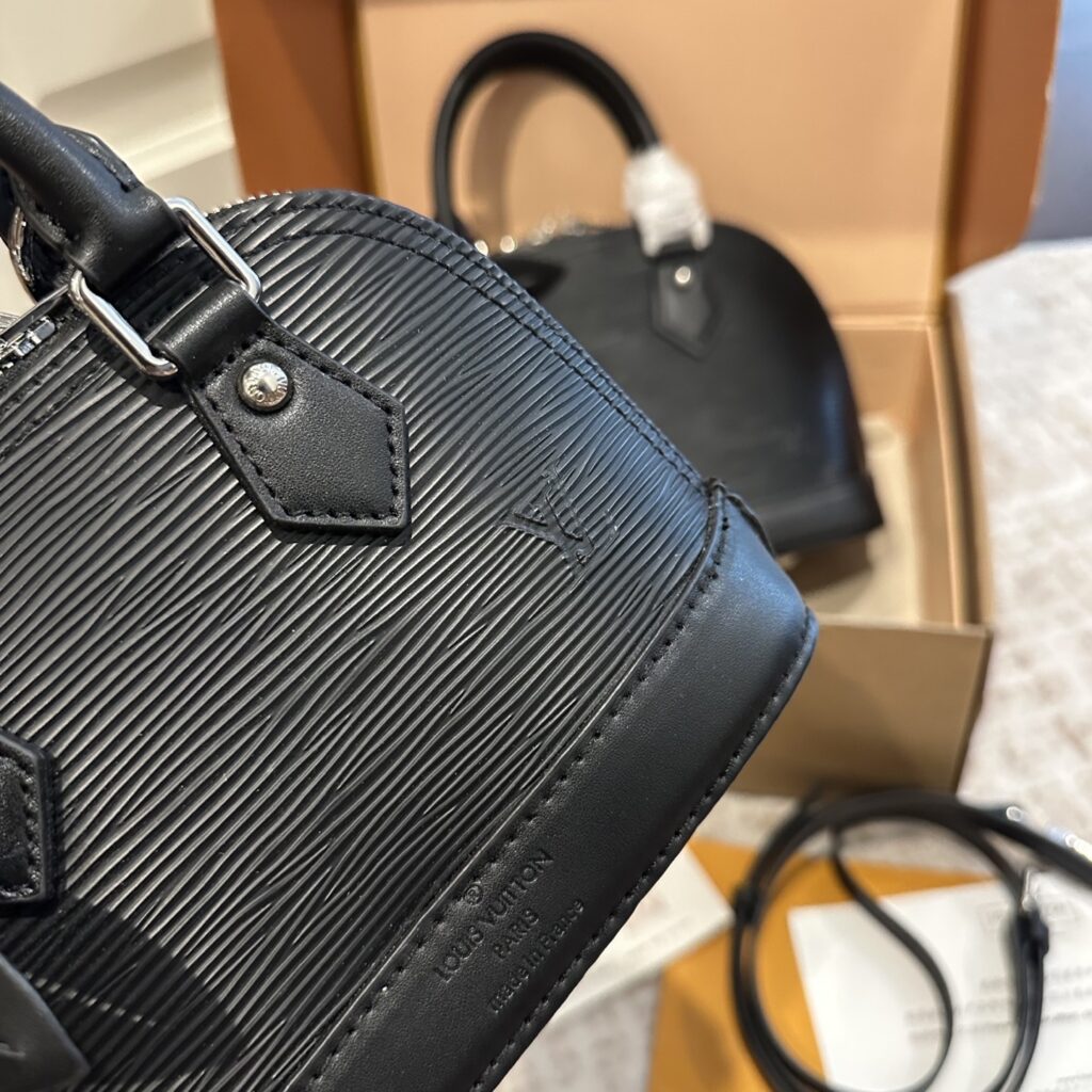 Louis Vuitton Alma Leather Handbag editorial product context 3