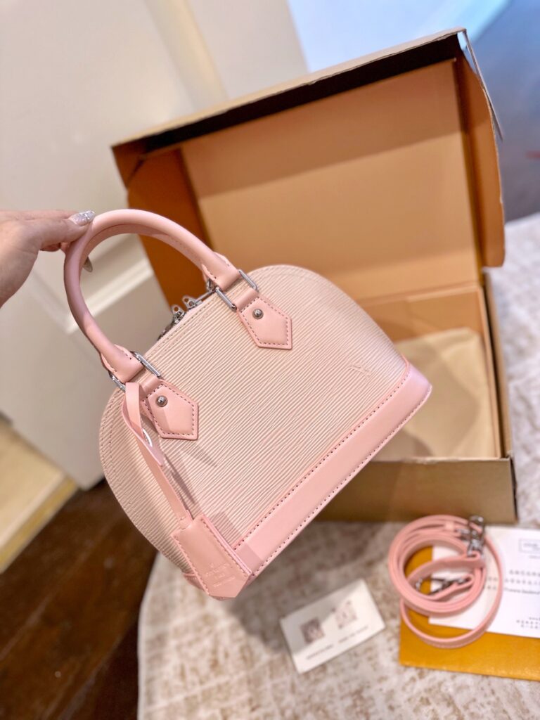 Louis Vuitton Alma Bb Pink Leather Handbag editorial product context 3