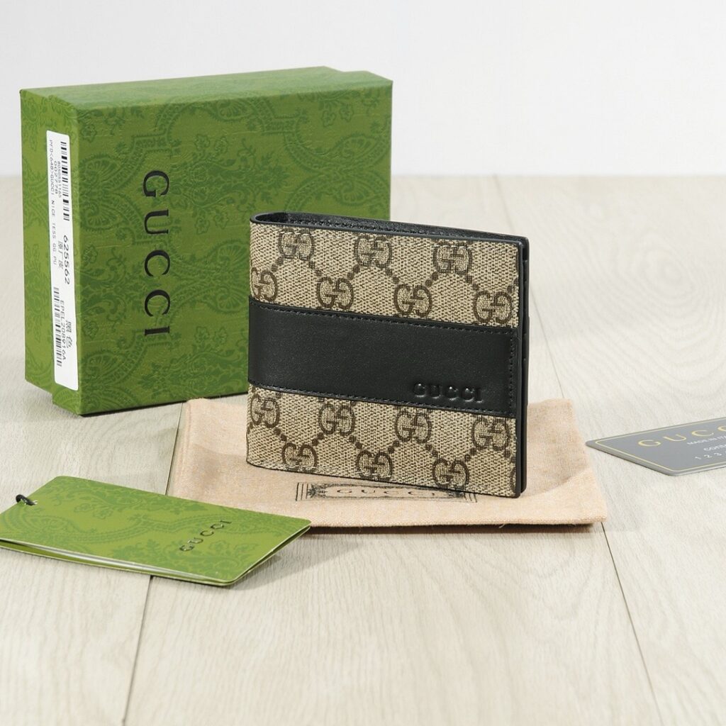 Gucci Gg Bi Fold Canvas Wallet editorial product context 1
