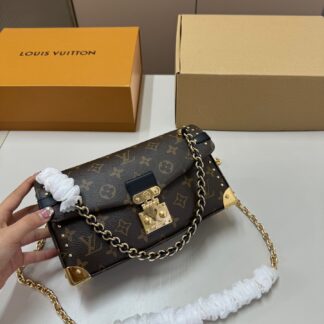 Louis Vuitton Petite Malle Leather THE IS coveted miniature trunk-inspired Crafted from signature materials like AND canvas IT features iconic detailing often with gold-tone hardware accents This structured silhouette CAN BE carried AS OR worn ITS detachable strap making ideal FOR evenings adding touch OF luxury TO daytime looks compact interior perfect carrying essential items Highlights design Versatile options Metal Available colors Brown Beige Black Multi sizes Dimensions Approx 20 12 color-brown color-beige color-black color-multi size-small color-gold color-brown-color-beige-color-black-color-multi-size-small material-leather material-canvas material-metal material-s-like-leather-and-canvas Mini Clutch