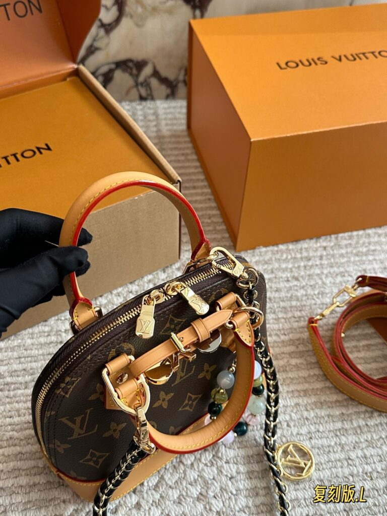 Louis Vuitton Alma Gold Leather Handbag editorial product context 2