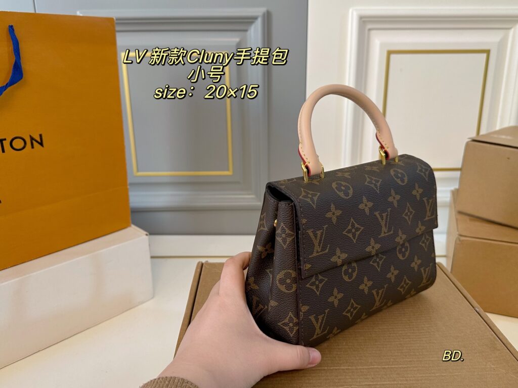 Louis Vuitton Cluny Small Black Calfskin Leather Clutch editorial product context 2