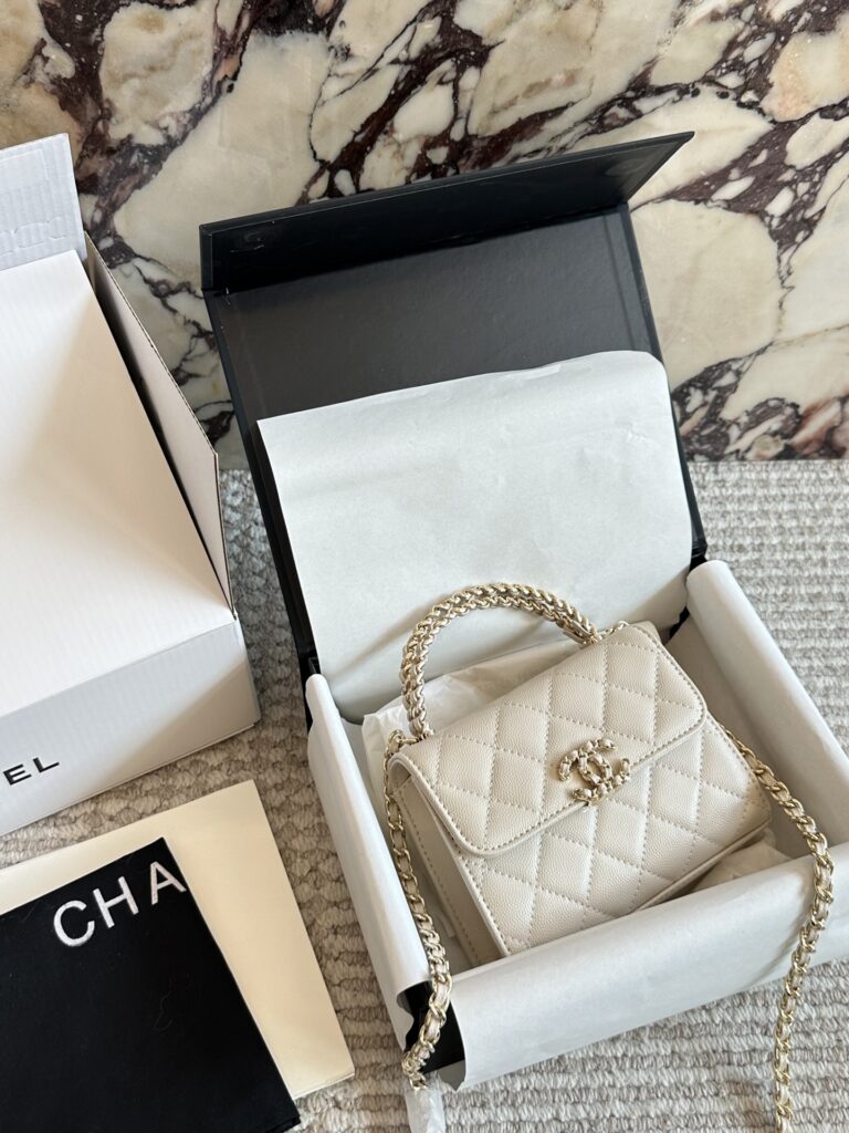 Chanel Kelly Mini Black Leather Clutch editorial product context 2