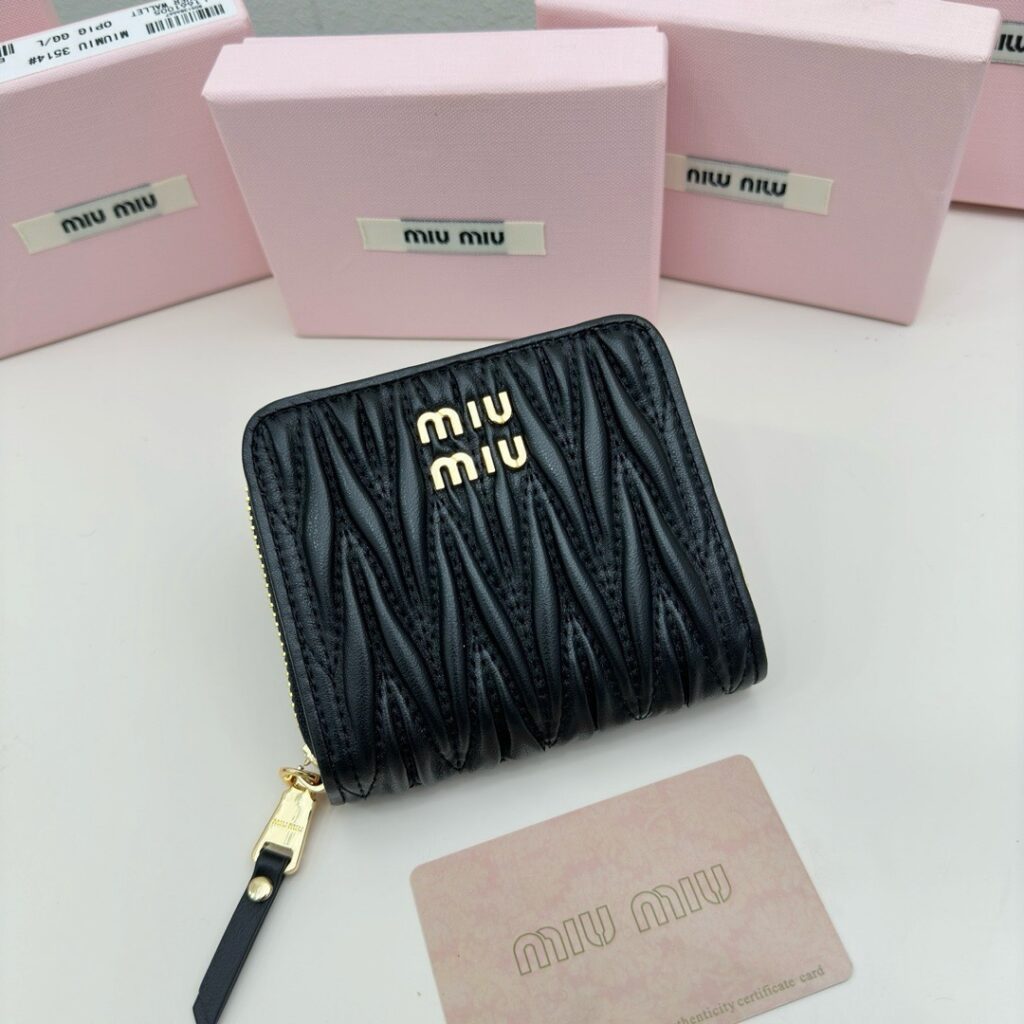 Miu Miu . Black Leather Bag 5 x 10 cm editorial product context 1